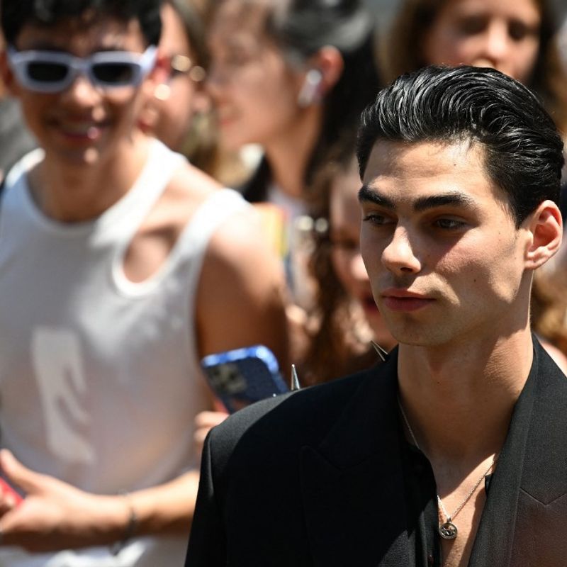 TikTok Star Jacob Rott arrives to attend Valentino's Men's Spring - Summer 2023 fashion show on June 16, 2023 as part of the Fashion Week in Milan. (Photo by Andreas SOLARO / AFP)