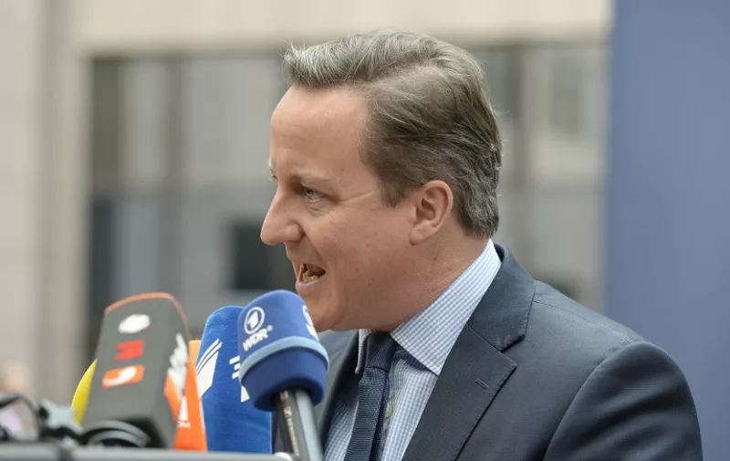 Britain's Prime Minister David Cameron speaks to the press as he arrives for an EU summit meeting, at the European Union headquarters in Brussels, on February 18, 2016. EU leaders head into a make-or-break summit sharply divided over difficult compromises needed to avoid Britain becoming the first country to crash out of the bloc.  AFP PHOTO / THIERRY CHARLIER / AFP / THIERRY CHARLIER