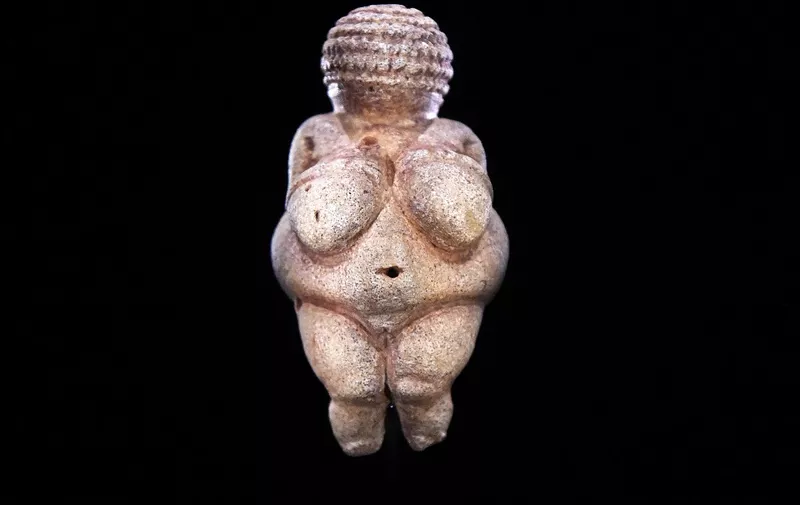 This photo taken on February 28, 2018 shows the prehistoric 'Venus of Willendorf' figurine pictured at the Natural History Museum in Vienna, Austria. - The 'Venus of Willendorf' figurine, considered a masterpiece of the paleolithic era, has been censored by Facebook, drawing an indignant response Wednesday from the Natural History Museum in Vienna, where it is on display. (Photo by Helmut FOHRINGER / APA / AFP) / Austria OUT
