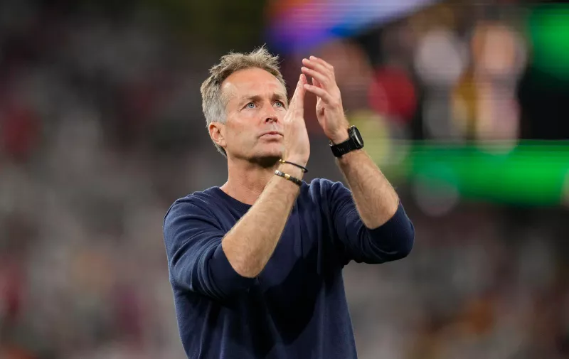 Denmark's head coach Kasper Hjulmand applauds fans after a round of sixteen match between Germany and Denmark at the Euro 2024 soccer tournament in Dortmund, Germany, Saturday, June 29, 2024. (AP Photo/Andreea Alexandru)