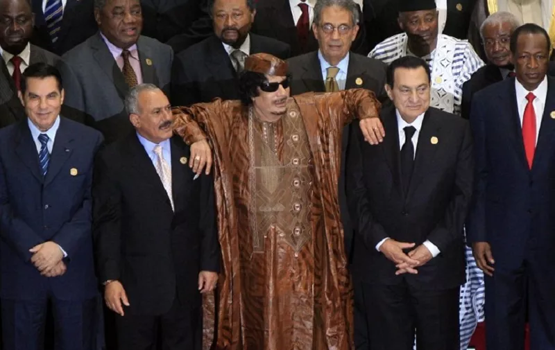 (FILES) This file photo taken on October 10, 2010 during an Afro-Arab joint summit in the Libyan coastal city of Sirte shows Libya's late deposed leader Moammar Gadhafi (C) leaning on former Egyptian president Hosni Mubarak (R) and Yemen's ex-pesident Ali Abdullah Saleh (L) as they pose for a group picture with other leaders, including Tunisia's deposed president Zine El Abidine Ben Ali.
Yemen's rebel-controlled interior ministry announced on December 4, 2017 the "killing" of former president Ali Abdullah Saleh, as a video emerged showing what appeared to be Saleh's corpse.
The 75-year-old strongman ruled Yemen for more than three decades, until his ouster under popular and political pressure in 2012. / AFP PHOTO / KHALED DESOUKI