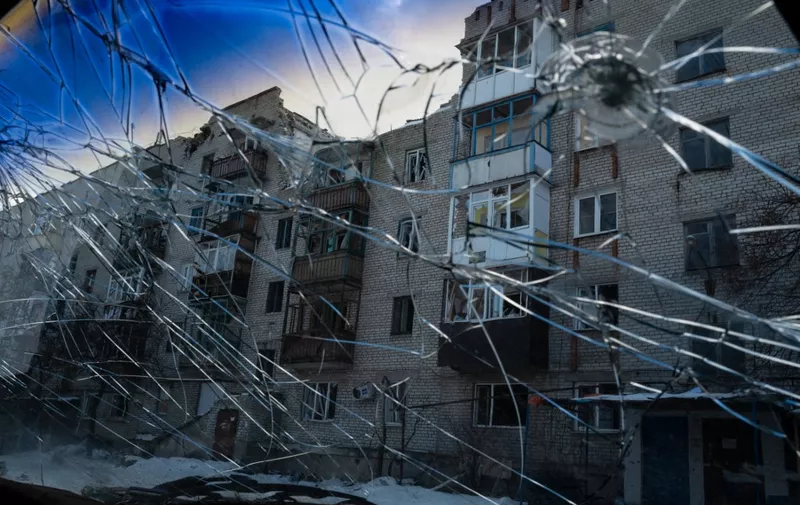 LYMAN, UKRAINE - FEBRUARY 20: Destruction is seen through a broken car window, amid Russia-Ukraine war in Lyman, Ukraine on February 20, 2023. Wolfgang Schwan / Anadolu Agency (Photo by Wolfgang Schwan / ANADOLU AGENCY / Anadolu Agency via AFP)
