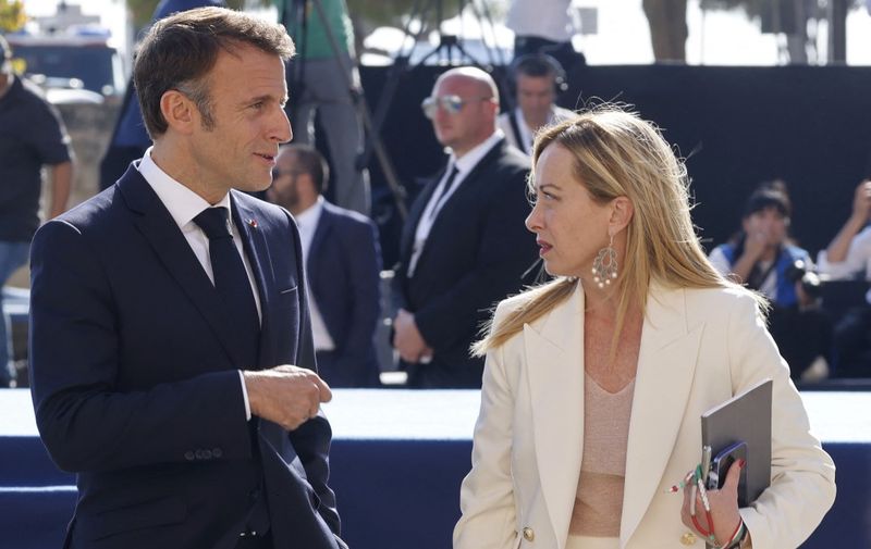 French President Emmanuel Macron and Italian Prime Minister Giorgia Meloni chat at Castille Square during the EU-MED9 summit on migration in Malta on September 29, 2023. The leaders of the "Med 9", which brings together Croatia, Cyprus, France, Greece, Italy, Malta, Portugal, Slovenia and Spain meet in Malta with European Commission for talks set to focus on migration. 
So far this year, the number of arrivals in Italy has surpassed 133,000, almost double the number during the same period last year, according to the government. (Photo by Ludovic MARIN / AFP)