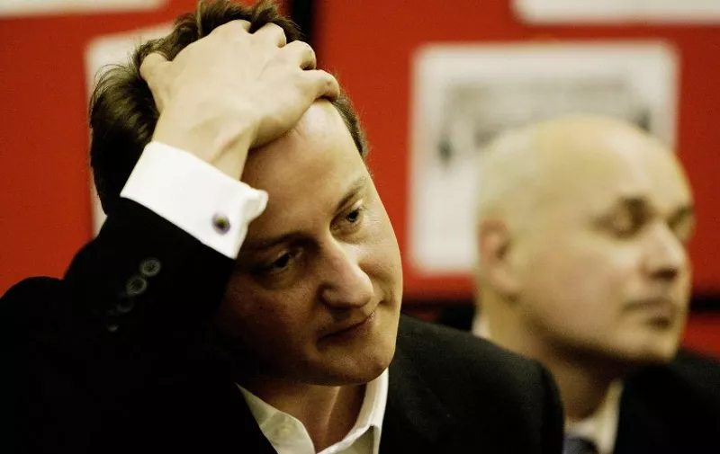 Leader of the British Conservative Party David Cameron (L) and former Tory leader Iain Duncan Smith attend a meeting at Eastside Young Leaders Academy, in east London, 07 December 2005, where they announced a new social justice policy group to tackle Britain's "broken society". Cameron faced Prime Minister Tony Blair at Prime Ministers Questions on his first day as Conservative Party Leader. AFP PHOTO/ANDREW PARSONS/WPA POOL/PA