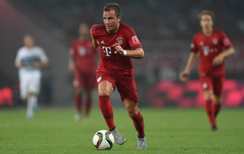 Bayern Munich's midfielder Mario Goetze vies for the ball during a friendly football match between Bayern Munich and Inter Milan in Shanghai on July 21, 2015.  AFP PHOTO / JOHANNES EISELE
