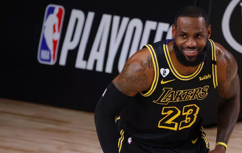 LAKE BUENA VISTA, FLORIDA - AUGUST 24: LeBron James #23 of the Los Angeles Lakers smiles as he gets ready for a play against the Portland Trail Blazers in Game Four of the Western Conference First Round during the 2020 NBA Playoffs at AdventHealth Arena at ESPN Wide World Of Sports Complex on August 24, 2020 in Lake Buena Vista, Florida. NOTE TO USER: User expressly acknowledges and agrees that, by downloading and or using this photograph, User is consenting to the terms and conditions of the Getty Images License Agreement.   Kevin C. Cox/Getty Images/AFP