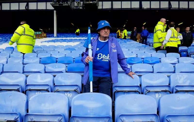 A Everton's fan stands dejected at the end of the English Premier League soccer match between Everton and Manchester City at the Goodison Park stadium in Liverpool, England, Sunday, May 14, 2023. Manchester City won 3-0. (AP Photo/Jon Super)