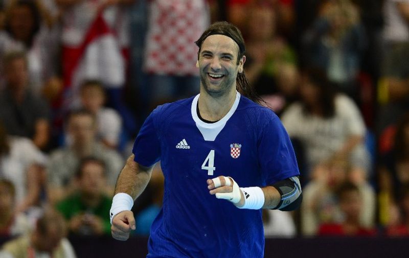 Croatia's centreback Ivano Balic reacts after a goal  during the men's preliminary Group B handball match Croatia vs Hungary for the London 2012 Olympics Games on August 2, 2012 at the Copper Box hall in London. Croatia won 26-19.     AFP PHOTO/ JAVIER SORIANO