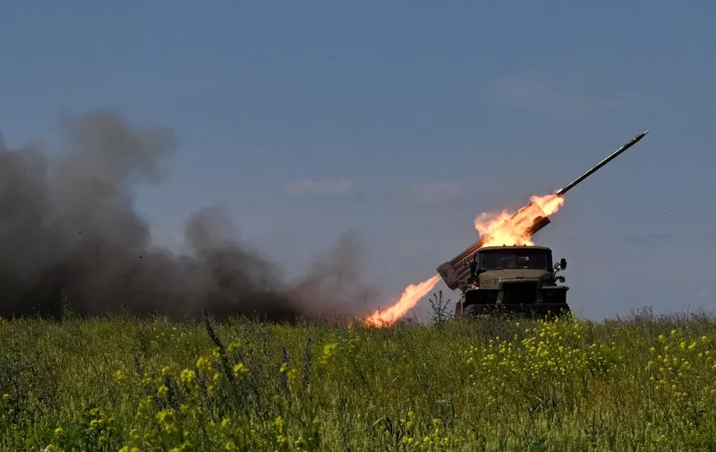 Ukrainian servicemen of the 57th Brigade fire BM-21 'Grad' multiple rocket launcher towards Russian positions at a front line near Bakhmut in the Donetsk region on June 20, 2023, amid the Russian invasion of Ukraine. (Photo by Genya SAVILOV / AFP)