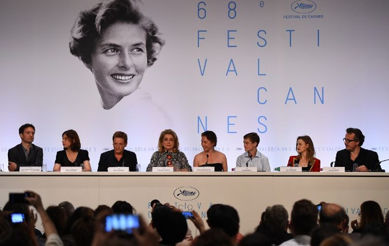 (From L) French producer Denis Pineau-Valencienne, screenwriter Marcia Romano, actor Benoit Magimel, actress Catherine Deneuve, director Emmanuelle Bercot, actor Rod Paradot, actress Sara Forestier and producer Francois Kraus attend a press conference for their film "Standing Tall" (Tete Haute) ahead of the opening of the 68th Cannes Film Festival in Cannes, southeastern France, on May 13, 2015. AFP PHOTO / ANNE-CHRISTINE POUJOULAT
