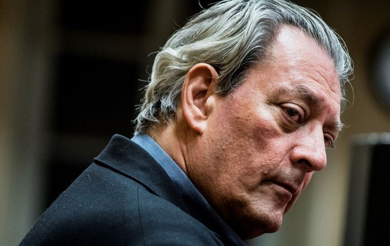 (FILES) US writer Paul Auster looks on in Lyon on January 16, 2018. Paul Auster, the prolific American author whose works included "The New York Trilogy," has died of complications from lung cancer, the New York Times reported April 30, 2024. He was 77. Auster died at his home in Brooklyn, the newspaper said, citing a friend of the novelist, Jacki Lyden. (Photo by JEFF PACHOUD / AFP)