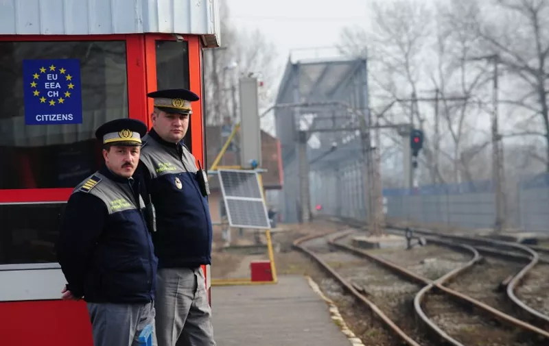 Romanian border police officers patrol the Ungheni train station at the border with Moldova on January 18, 2011. Romanian border police is tightening controls at the border with Moldova in order to fulfill requirements to enter the border-free Schengen zone in March 2011, but France and Germany have publicly opposed such a move. Bucharest insists that formerly Schengen enlargements were made only on the basis of technical criteria like the implementation of a secure border control system and warns against an "unfair change of the rules".   AFP PHOTO / DANIEL MIHAILESCU