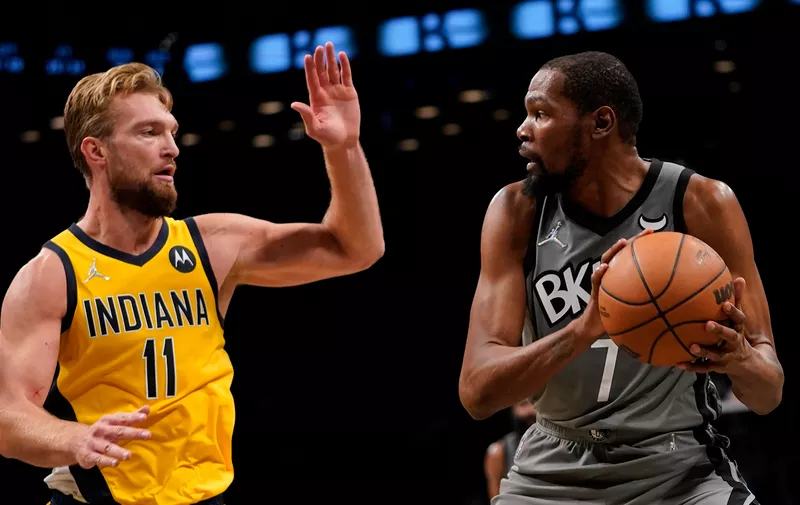 Indiana Pacers forward Domantas Sabonis (11) defends against Brooklyn Nets forward Kevin Durant (7) during the second half of an NBA basketball game, Friday, Oct. 29, 2021, in New York. The Nets won 105-98. (AP Photo/Mary Altaffer)