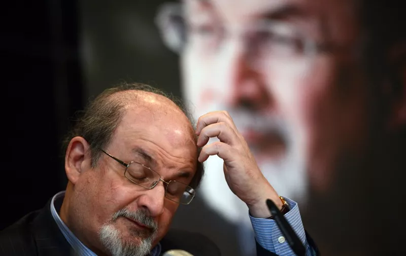 British author Salman Rushdie addresses the press during the presentation of his book "Joseph Anton" on October 1, 2012 in Berlin. As violent protests over a US-made film rock the Muslim world, Salman Rushdie publishes his account of the decade he spent in hiding while under a fatwa for his book "The Satanic Verses".     AFP PHOTO / JOHANNES EISELE (Photo by JOHANNES EISELE / AFP)