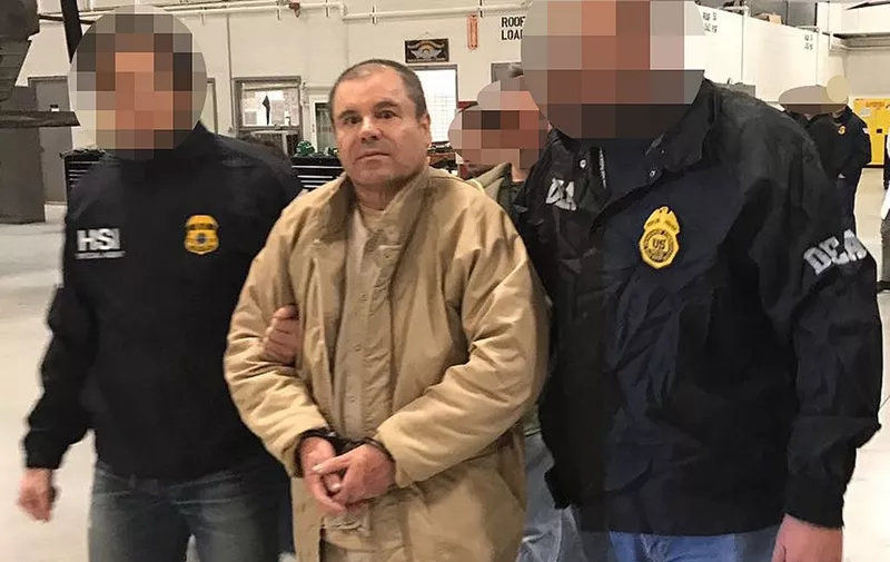 (FILES) In this file photo taken on January 19, 2017 This handout picture released by the Mexican Interior Ministry on January 19, 2017 shows Joaquin Guzman Loera aka "El Chapo" Guzman (C) escorted in Ciudad Juarez by the Mexican police as he is extradited to the United States. - After a dramatic decades-long run as one of the world's most notorious druglords, there is little suspense about what will happen in a New York courtroom on Wednesday: Joaquin "El Chapo" Guzman is expected to be sentenced to life in prison. (Photo by HO / INTERIOR MINISTRY OF MEXICO / AFP) / RESTRICTED TO EDITORIAL USE-MANDATORY CREDIT "AFP PHOTO/INTERIOR MINISTRY OF MEXICO" NO MARKETING NO ADVERTISING CAMPAIGNS-DISTRIBUTED AS A SERVICE TO CLIENTS-XGTY / TO GO WITH AFP STORY BY Laura BONILLA CAL: "El Chapo expected to get life sentence from US judge"




 Pixelation of faces was done by the US Department of Justice