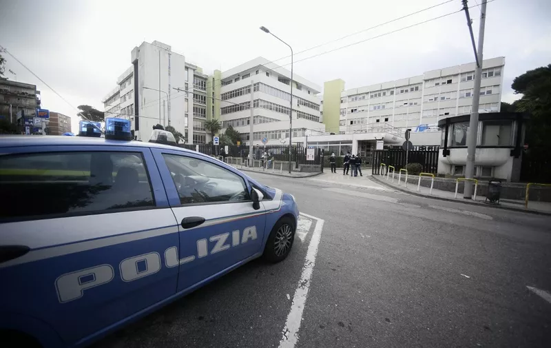 A car of the Italian State Police is parked in front of the emergency access of Cardarelli hospital in Naples on November 12, 2020 amid a surge of COVID-19 cases in Naples overwhelming hospitals. The Italian government imposed tighter restrictions on another five regions on November 10 as it tries to stem escalating new cases of coronavirus, while still resisting a nationwide lockdown. (Photo by Filippo MONTEFORTE / AFP)