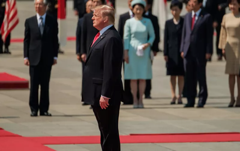 TOKYO, JAPAN - MAY 27: U.S. President Donald Trump reviews an honour guard during a welcome ceremony at the Imperial Palace on May 27, 2019 in Tokyo, Japan. President Trump is on the third day of a four day state visit to Japan, the first official visit of the country's Reiwa era. Alongside a number of engagements, Mr Trump was guest of honour at a Sumo wrestling match on Sunday and is expected to meet families of North Korean abductees. (Photo by Nicolas Datiche - Pool/Getty Images)