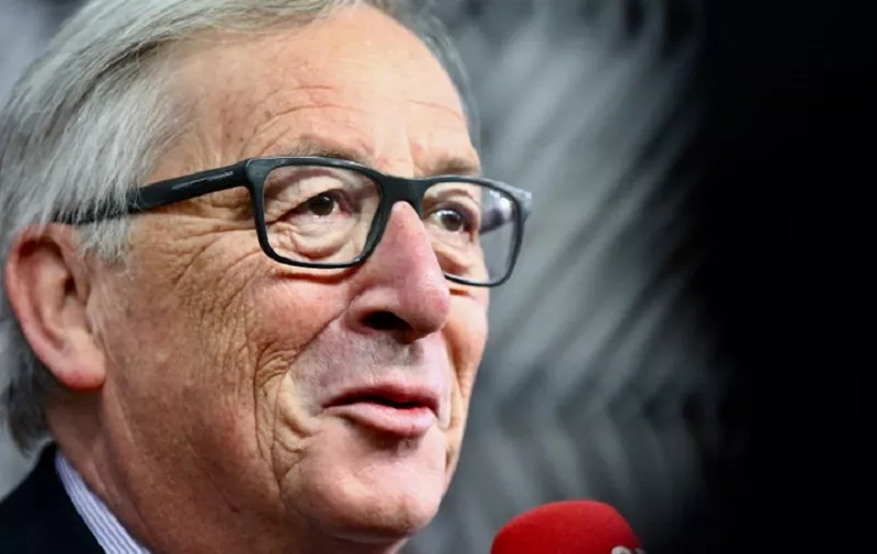European Commission President Jean-Claude Juncker speaks to journalists as he arrives for an ?EU Eastern Partnership summit with six eastern partner countries at the European Council in Brussels on November 24, 2017.
Leaders from the EU and six former Soviet states meet in Brussels on November 24 for the latest summit aimed at deepening ties, but thorny subjects like Russian influence and the war in Ukraine are off the agenda. / AFP PHOTO / Aurore BELOT