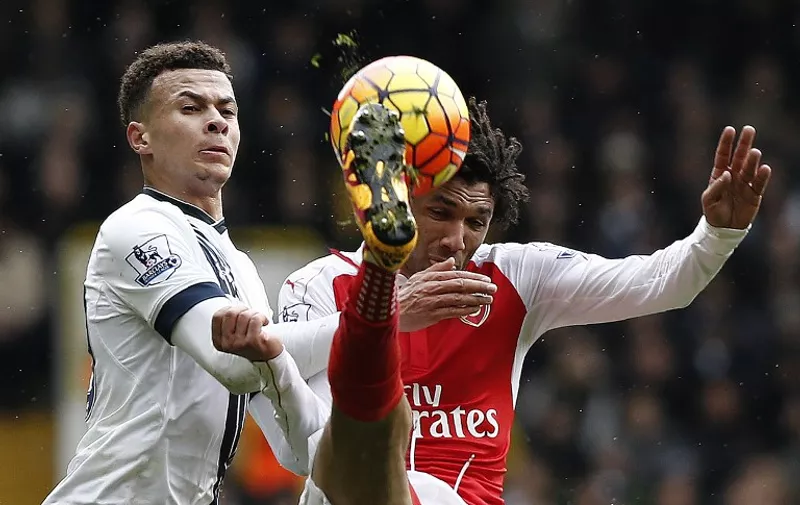 Tottenham Hotspur's English midfielder Dele Alli (L) vies with Arsenal's Egyptian midfielder Mohamed Elneny during the English Premier League football match between Tottenham Hotspur and Arsenal at White Hart Lane in London, on March 5, 2016. / AFP / ADRIAN DENNIS / RESTRICTED TO EDITORIAL USE. No use with unauthorized audio, video, data, fixture lists, club/league logos or 'live' services. Online in-match use limited to 75 images, no video emulation. No use in betting, games or single club/league/player publications.  /