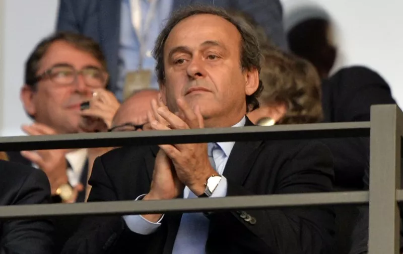 UEFA President Michel Platini applauds during the UEFA Champions League Final football match between Juventus Torino and FC Barcelona at the Olympic Stadium in Berlin on June 6, 2015. AFP PHOTO / OLIVER LANG