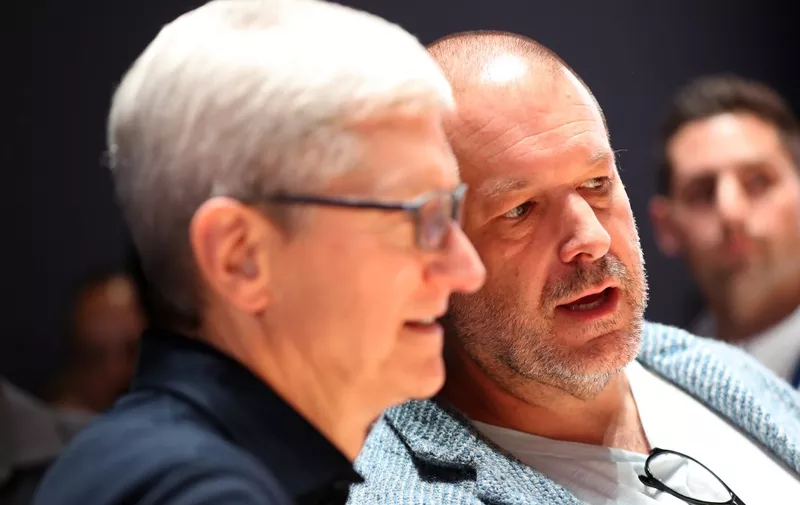 (FILES) In this file photo taken on June 3, 2019 Apple CEO Tim Cook (L) and Apple chief design officer Jony Ive (R) look at the new Mac Pro during the 2019 Apple Worldwide Developer Conference (WWDC) at the San Jose Convention Center in San Jose, California. - Apple announced June 27, 2019 its star design chief Jony Ive, who played a key role in the development of the iPhone and other products, was leaving to set up his own firm.Ive will depart later this year "to form an independent design company which will count Apple among its primary clients," Apple said in a statement. (Photo by JUSTIN SULLIVAN / GETTY IMAGES NORTH AMERICA / AFP)