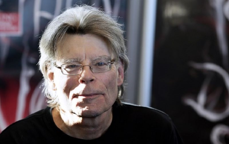 American author Stephen King poses for photographers on November 13, 2013 in Paris, before a book signing event dedicated to the release of his new book "Doctor Sleep", the sequel to his 1977 novel "The Shining". The best-selling author has written over 50 novels and sold 350 million copies worldwide.   AFP PHOTO / KENZO TRIBOUILLARD / AFP PHOTO / KENZO TRIBOUILLARD