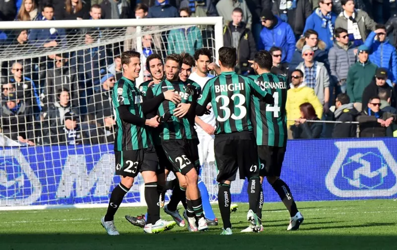 Sassuolo's forward Domenico Berardi (2ndL) celebrates with teammates after scoring a penalty during the Italian Serie A football match between Sassuolo and Inter Milan at "Mapei Stadium"  in Reggio Emilia  on February 01, 2015 . AFP PHOTO / GIUSEPPE CACACE