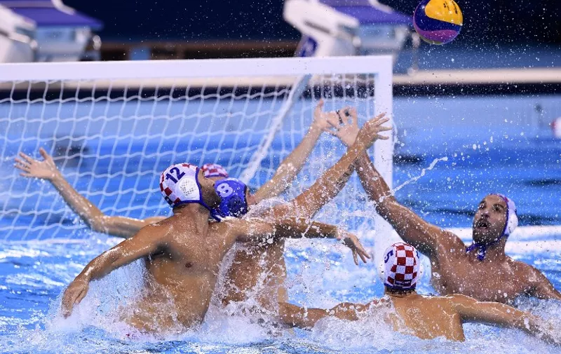 Croatia's and Serbia's players vie for the ball during the Rio 2016 Olympic Games water polo final match on August 20, 2016 at the Olympic Aquatics Stadium in Rio de Janeiro, Brazil.   / AFP PHOTO / GABRIEL BOUYS