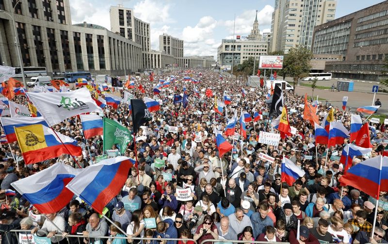 Demonstrators take part in a rally to support opposition and independent candidates after authorities refused to register them for September elections to the Moscow City Duma, Moscow, July 20, 2019. (Photo by Maxim ZMEYEV / AFP)