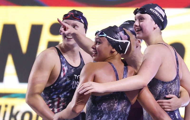 220623 -- BUDAPEST, June 23, 2022 -- Katie Ledecky, Bella Sims, Leah Smith and Claire Weinstein from L to R of the United States celebrate after the women s 4x200m freestyle relay final at the 19th FINA World Championships in Budapest, Hungary on June 22, 2022.  SPHUNGARY-BUDAPEST-FINA WORLD CHAMPIONSHIPS-SWIMMING-WOMEN S 4X200M FREESTYLE RELAY LixYing PUBLICATIONxNOTxINxCHN