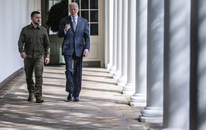 US President Joe Biden and Ukrainian President Volodymyr Zelensky walk through the colonnade to the Oval Office at the White House in Washington, DC, on September 21, 2023. (Photo by Jim WATSON / POOL / AFP)