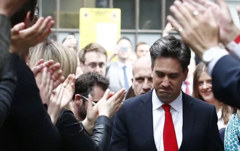 Opposition Labour party leader Ed Miliband (C) and his wife Justine Thornton arrive at Labour party headquarters in London on May 8, 2015, the day after a general election. Prime Minister David Cameron's Conservatives looked on course Friday for a surprise victory in Britain's general election which would redefine the country's future in Europe and herald more austerity cuts.   AFP PHOTO / JUSTIN TALLIS