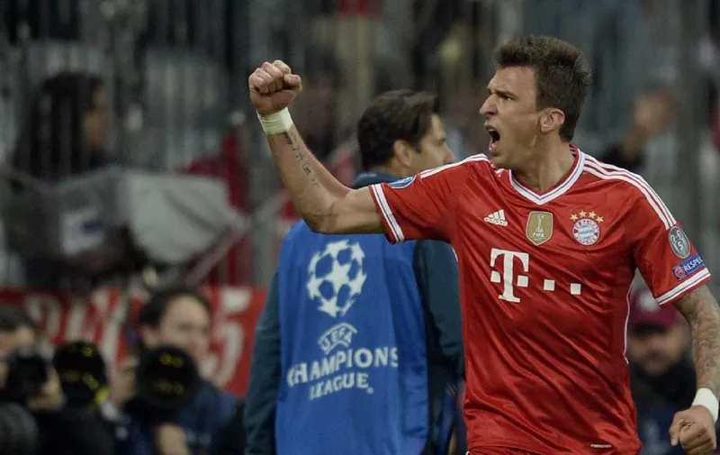 Bayern's Mario Mandzukic of Croatia reacts during the UEFA Champions League quarter-final second leg football match Bayern Munich vs Manchester United in Munich, southern Germany, on April 9, 2014.  AFP PHOTO / JOHANNES EISELE (Photo by JOHANNES EISELE / AFP)
