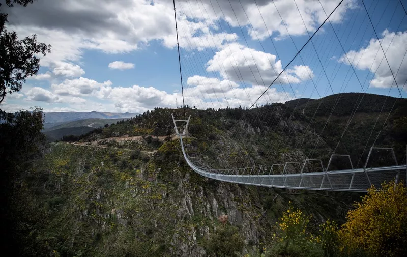 A general view shows the 516 Arouca Bridge, the world's longest pedestrian suspension bridge with a length of 516 metres and a height of 175 metres, in Arouca in northern Portugal on April 29, 2021. (Photo by CARLOS COSTA / AFP)