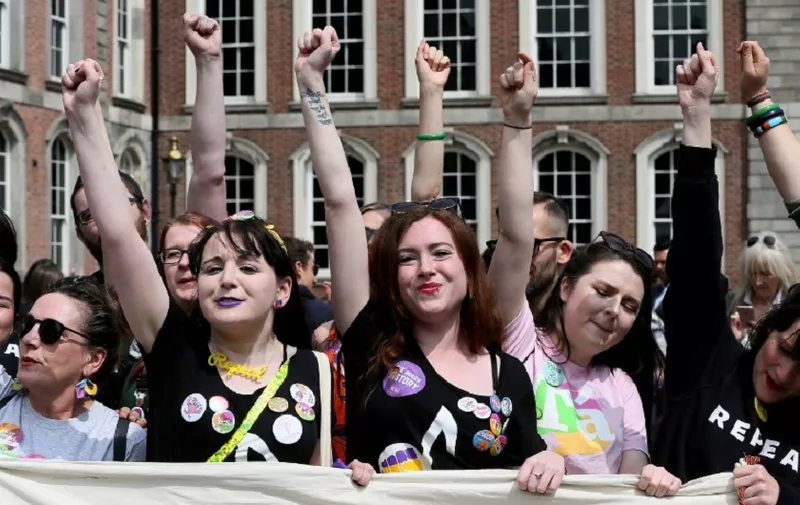 Yes campaigners jubilate as they wait for the official result of the Irish abortion referendum, at Dublin Castle in Dublin on May 26, 2018. 
The first official results declared in Ireland's historic referendum on its strict abortion laws, showed 60 percent in the Galway East constituency backed repealing the constitutional ban on terminations. / AFP PHOTO / Paul FAITH