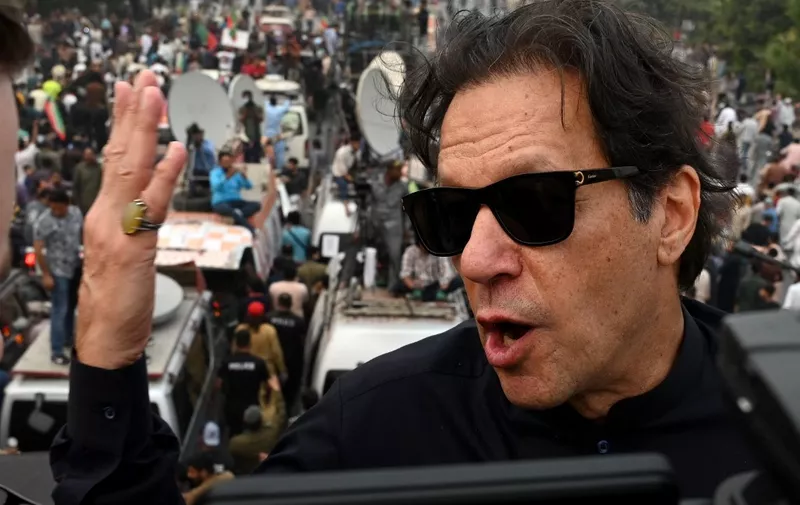 In this photograph taken on November 1, 2022, Pakistan's former prime minister Imran Khan speaks while taking part in an anti-government march in Gujranwala. - Khan was shot in the foot at a political rally on November 3, 2022 but he is in a stable condition, an aide said. (Photo by Arif ALI / AFP)