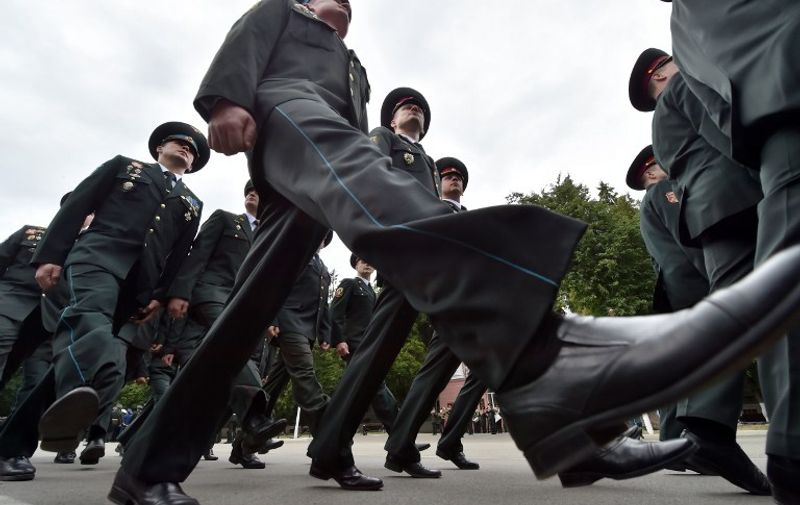 TOPSHOTS
Graduates of the Ukrainian National University of Defence (Military academy of Ukrainian Forces) march during a graduate ceremony in Kiev on June 26, 2015. Some 350 of the senior officers get diplomas of strategic and theatre-of-war level of training.  AFP PHOTO/ SERGEI SUPINSKY