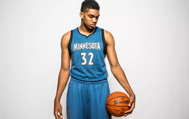 TARRYTOWN, NY - AUGUST 08: Karl-Anthony Towns #32 of the Minnesota Timberwolves poses for a portrait during the 2015 NBA rookie photo shoot on August 8, 2015 at the Madison Square Garden Training Facility in Tarrytown, New York. NOTE TO USER: User expressly acknowledges and agrees that, by downloading and or using this photograph, User is consenting to the terms and conditions of the Getty Images License Agreement.   Nick Laham/Getty Images/AFP