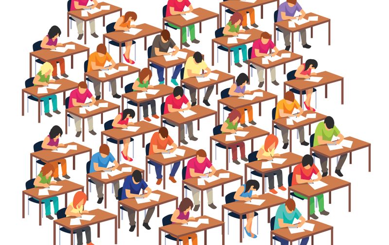 Large exam classroom hall full of students at their desks writing a test. Flat style vector illustration isolated on white background.
