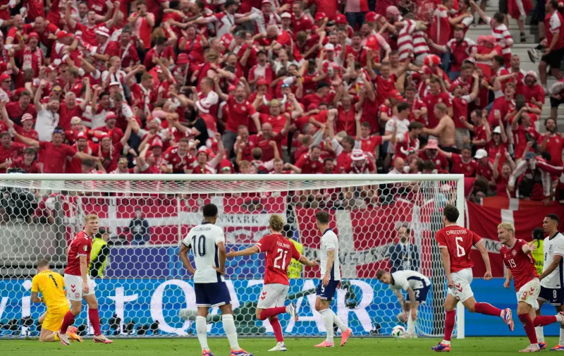 Denmark's Morten Hjulmand (21) celebrates scoring his side's first goal during a Group C match between Denmark and England at the Euro 2024 soccer tournament in Frankfurt, Germany, Thursday, June 20, 2024. (AP Photo/Thanassis Stavrakis)