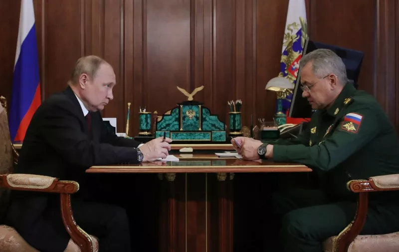 Russian President Vladimir Putin meets with Defence Minister Sergei Shoigu at the Kremlin in Moscow on July 4, 2022. (Photo by Mikhail Klimentyev / SPUTNIK / AFP)