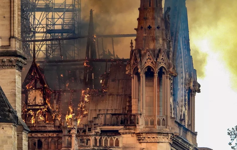 Smoke and flames rise from Notre-Dame Cathedral on April 15, 2019 in Paris, France. A fire broke out on Monday afternoon and quickly spread across the building, collapsing the spire. The cause is yet unknown but officials said it was possibly linked to ongoing renovation work.//HOUPLINERENARD_08180053/1904160833/Credit:HOUPLINE/SIPA/1904160835, Image: 426318252, License: Rights-managed, Restrictions: , Model Release: no, Credit line: Profimedia, TEMP Sipa Press