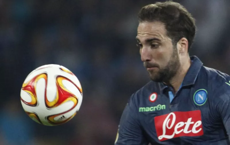 Napoli's forward from Argentina and France Gonzalo Higuain eyes the ball during the UEFA Europa League semi final first leg football match SSC Napoli vs FK Dnipro Dnipropetrovsk on May 7, 2015 at the San Paolo Stadium in Naples.AFP PHOTO / CARLO HERMANN