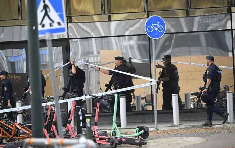 Police secures the area after two persons have been injured in a shooting at Emporia Shopping Center in Malmo, Sweden, on August 19, 2022. (Photo by Johan NILSSON / TT News Agency / AFP) / Sweden OUT