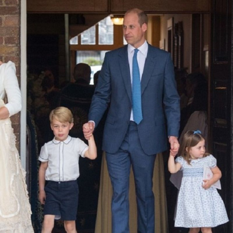 Britain's Princess Charlotte of Cambridge and Britain's Prince George of Cambridge hold hands with their father, Britain's Prince William, Duke of Cambridge, as Britain's Prince Louis of Cambridge is carried by his mother, Britain's Catherine, Duchess of Cambridge after his christening service at the Chapel Royal, St James's Palace, London on July 9, 2018. / AFP PHOTO / POOL / Dominic Lipinski