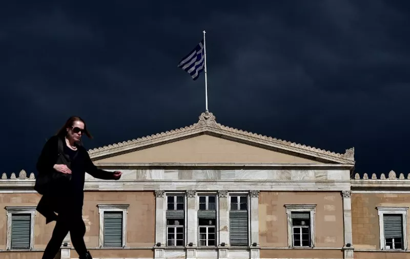 A woman walks in front of the Greek Parliament in Athens on April 7, 2015. Greek lawmakers voted on April 7 to set up a committee to examine the circumstances under which Greece agreed to bailouts totaling 240 billion euros (USD 260 billion) with the European Union and International Monetary Fund. AFP PHOTO / ARIS [&hellip;]
