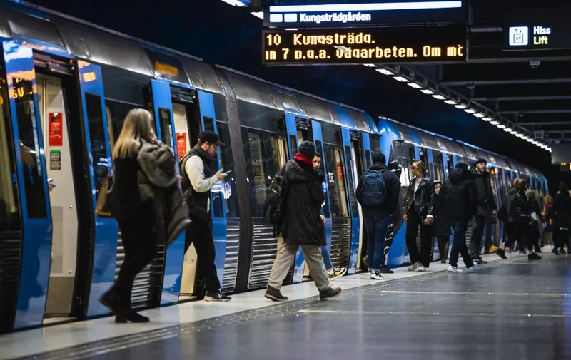 Daily commuters arrive with the metro at Stockholm's central station on December 3, 2020, during the novel coronavirus COVID-19 pandemic. (Photo by Jonathan NACKSTRAND / AFP)