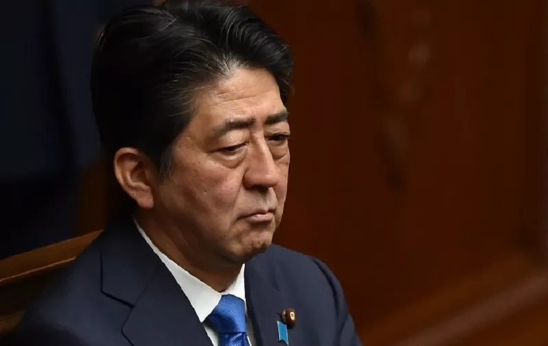 Japanese Prime Minister Shinzo Abe attends a plenary session of the House of Representatives at the end of 150-day regular Diet session on June 1, 2016.  
Japanese leader Shinzo Abe is set to announce June 1 that he will delay a consumption tax hike and launch another blast of government spending, underscoring his failure to ignite the limp economy, analysts said. / AFP PHOTO / KAZUHIRO NOGI