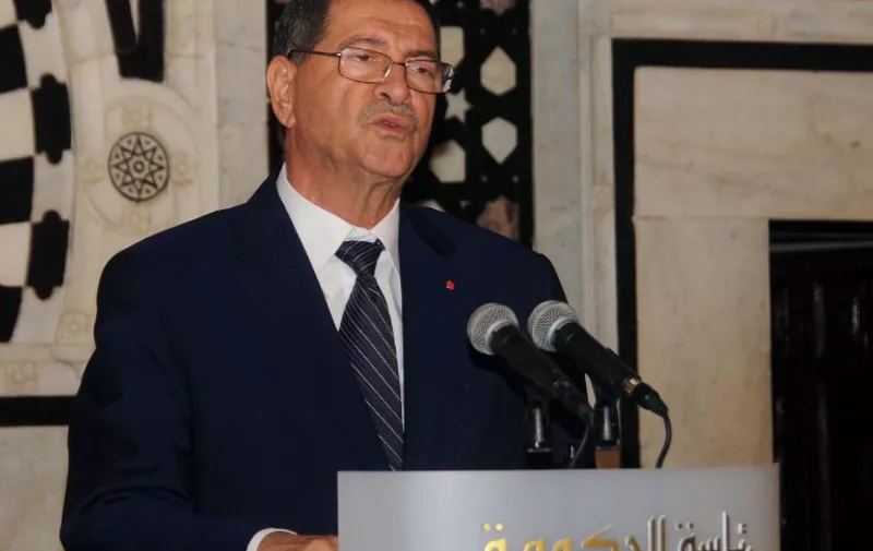Tunisian Prime Minister Habib Essid speaks at a press conference in Tunis on June 26, 2015 after the mass shooting in the resort town of Sousse, a popular tourist destination 140 kilometers (90 miles) south of the Tunisian capital. At least 37 people, including foreigners, were killed at a Tunisian beach resort packed with holidaymakers, in the North African country's worst attack in recent history. AFP PHOTO/SALAH HABIBI