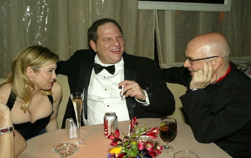BEVERLY HILLS, CA - JANUARY 25:  Actress Rene Zellweger(L), Harvey Weinstein and director Anthony Minghella attend the Miramax Golden Globes After-Party at Trader Vics on January 25, 2004 in Beverly Hills, California. (Photo by Kevin Winter/Getty Images) *** Local Caption *** Rene Zellweger;Harvey Weinstein;Anthony Minghella